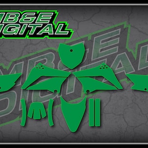 May include: Green motocross graphics kit for a motorcycle. The kit includes a front fender, rear fender, side panels, number plates, and fork guards.