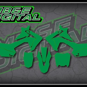 May include: Green motocross graphics kit for a motorcycle. The kit includes a front fender, rear fender, side panels, and number plates.