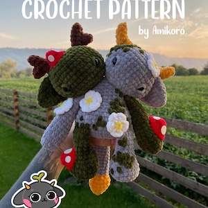 May include: A handmade crochet pattern for two whimsical creatures. One is green and the other is gray, both adorned with white flowers, red mushroom accents, and heart-shaped antlers. The text "CROCHET PATTERN by Amikoro" is displayed at the top.