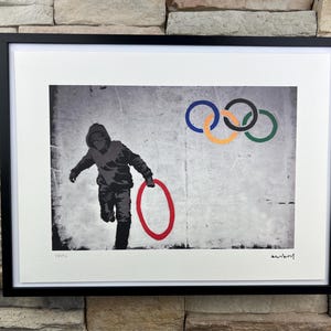 BANKSY: Framed lithograph. Limited edition with certificate, hand-numbered out of 150 copies.