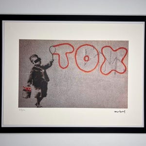 BANKSY: Framed lithograph. Limited edition with certificate, hand-numbered out of 150 copies.