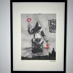 BANKSY : Lithographie encadrée. Édition limitée avec certificat, numérotée à la main sur 150 exemplaires.