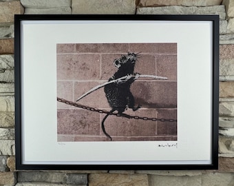 BANKSY: Framed lithograph. Limited edition with certificate, hand-numbered out of 150 copies.