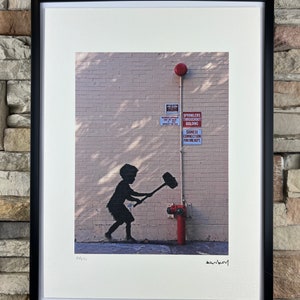 BANKSY: Framed lithograph. Limited edition with certificate, hand-numbered out of 150 copies.
