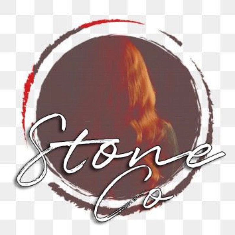 May include: A white circle with a red outline and the text "Stone Co." in white cursive writing. The circle contains a blurry image of a person with long red hair.