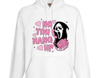 May include: White hoodie with a pink graphic of a ghost holding a pink phone and the text "NO YOU HANG UP".