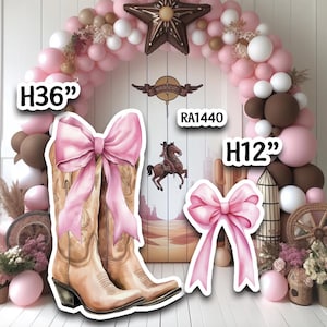 May include: A western-themed party decoration set featuring a pair of cowboy boots with a pink bow, a pink bow, and a horse illustration. The boots are 36 inches (91 cm) tall. The set includes a balloon arch with pink, white, and brown balloons.