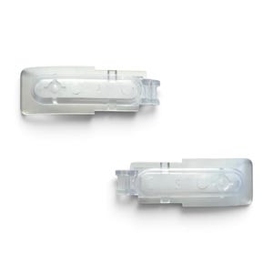 May include: Two clear plastic rectangular clips with a hinged mechanism on one end. Each clip features a central elongated oval indentation with two circular recessed points, designed for securing or attaching items in a functional capacity.