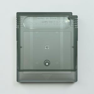 May include: A translucent gray Game Boy cartridge. The cartridge has the words "Nintendo GAME BOY" printed on it. The cartridge is rectangular with a slightly rounded top and a beveled bottom edge. The cartridge is made of plastic.
