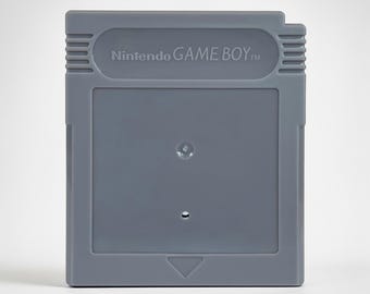 Carcasa de cartucho de Game Boy de repuesto en rosa, negro, blanco, transparente y ahumado, con colores de Pokémon que brillan en la oscuridad.