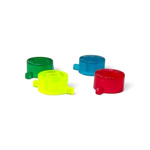 May include: Four small, circular, translucent plastic caps in vibrant colors. The set includes one green, one bright yellow, one blue, and one red cap. Each cap features a small, protruding tab on the side, designed for easy handling and attachment.