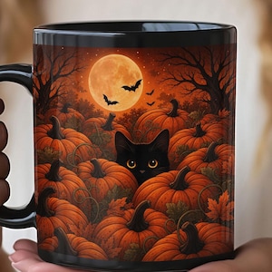 May include: A black ceramic mug featuring a vibrant Halloween-themed illustration of a black cat with glowing yellow eyes peeking out from a dense patch of orange pumpkins under a large full moon, dark silhouettes of trees, and flying bats.