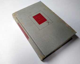 May include: A gray book with a red spine and a red title block that reads "The Poems of Longfellow".
