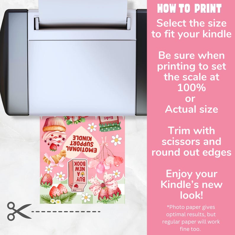 May include: A printer printing a pink and white Kindle cover with a strawberry and cupcake design. The cover includes the text "EMOTIONAL SUPPORT KINDLE" and "BUY A NEW BOOK". Instructions on how to print are on the right.