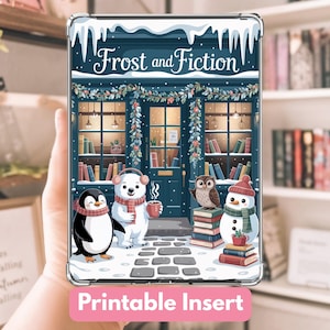 May include: A clear case with a winter-themed illustration. The design features a bookstore with a penguin, polar bear, owl, and snowman. The text "Frost and Fiction" is at the top, and "Printable Insert" is at the bottom.