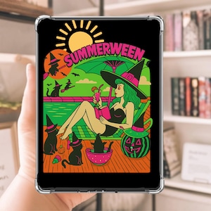 May include: A black tablet case featuring a colorful illustration with the word "SUMMERWEEN". The image depicts a witch relaxing by a pool, with black cats, a jack-o'-lantern, and a sun.