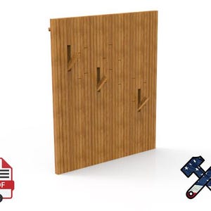 May include: A wooden wall panel with three angled hooks. The panel is made of vertical wooden planks and has a light brown color. The hooks are cut into the wood. The panel is designed for hanging items.