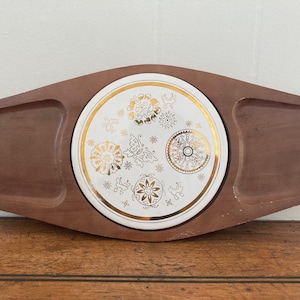 May include: A wooden serving tray with a removable white ceramic dish. The dish has a gold rim and a decorative design of butterflies and flowers.