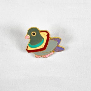 Cute Bread Necklace Pigeon Enamel Pin – Funny Bird Lover Gift – Backpack, Lanyard, or Jacket Accessory
