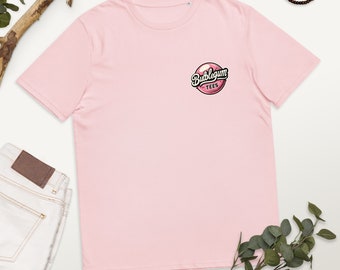 Può includere: Maglietta rosa con un logo di chewing gum che dice "Bubblegum Tees".