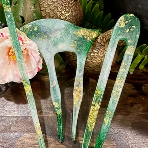 Golden Green hair accessory sticks.