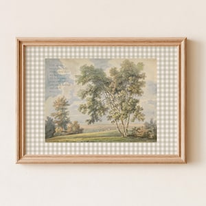 May include: A framed landscape print featuring a watercolour painting of trees on a grassy hill under a cloudy sky. The text reads: I lift up my eyes to the hills. From where does my help come? My help comes from the LORD, who made heaven and earth. Psalm 121:1-2. The frame is light wood with a beige and white gingham mat.