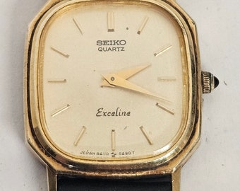 Super seltene Vintage 1980er Jahre Seiko Exceline 8420-5420 Gold-Ton Damenuhr. Schwarzes Lederband. Funktioniert Perfekt. KOSTENLOSER VERSAND