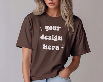 May include: An oversized brown t-shirt with the text "your design here" in white with a retro font and small white stars.