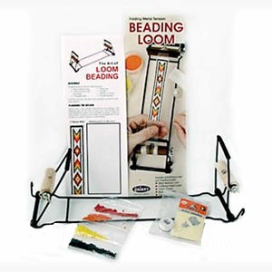 May include: A black metal beading loom with a wooden handle and a white and orange beaded design. The loom is set up on a black metal stand. The kit includes beads, needles, and instructions. The Art of Loom Beading.