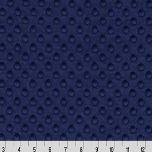 May include: Navy blue fabric with a textured, raised dot pattern.