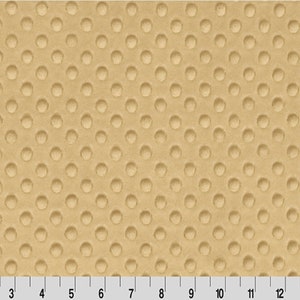 May include: Beige fabric with a textured pattern of small, raised circles.
