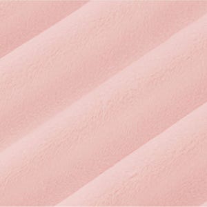 May include: A soft, pale pink fabric with a subtle texture. The fabric is smooth and has a slightly fuzzy appearance.