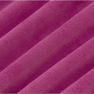 May include: Close-up of a soft, plush fabric in a deep purple hue. The fabric has a subtle texture and a slightly fuzzy appearance.