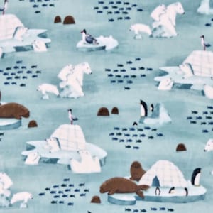 May include: A light blue fabric with an arctic scene featuring polar bears, seals, penguins, and igloos. The design includes schools of fish and seagulls, creating a whimsical, illustrated pattern. The overall theme is a winter wonderland.