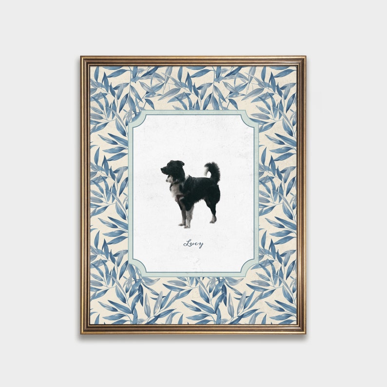 May include: A framed print of a black and white dog with a blue and white floral border. The dog is standing and looking to the right. The print has the name "Lucy" written below the dog.