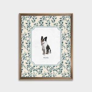 May include: A framed print with a white background and a blue and white border. The print features a black and white border collie dog sitting and the name "Winston" written below the dog.