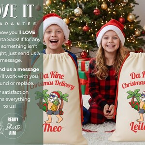 May include: Two cream-colored Santa sacks with red trim and the text "Da Kine Christmas Delivery." Each sack features a cartoon Santa Claus with a pineapple head and the names "Theo" and "Leilani." Children wearing Santa hats and pajamas are in the background.
