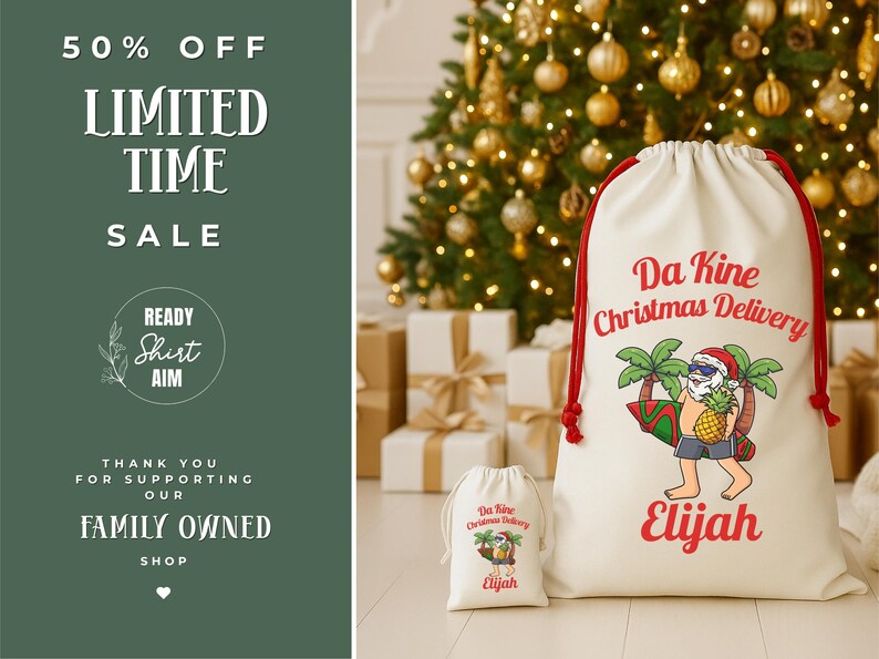 May include: Two white Christmas gift bags with red drawstrings. The larger bag features the text "Da Kine Christmas Delivery" and a cartoon Santa Claus with sunglasses, a surfboard, and a pineapple. The name "Elijah" is printed below. A smaller matching bag is also present.