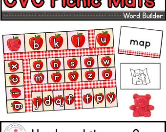 May include: A hands-on literacy game with CVC Picnic Mats. The set includes letter cards with red apple graphics, a "map" word card, and a red gummy bear. The game is designed for word building and literacy development.