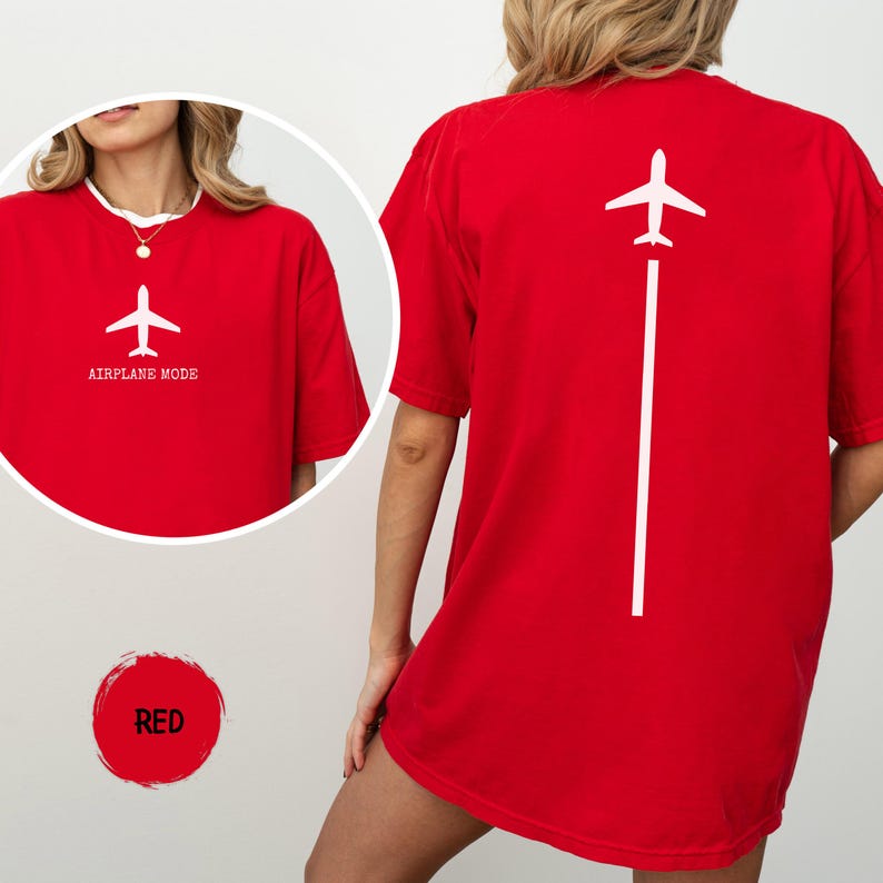May include: Red t-shirt with a white airplane graphic and the text "AIRPLANE MODE" on the front. The back of the shirt features a white airplane graphic with a white line extending downwards. The shirt is a solid red color.