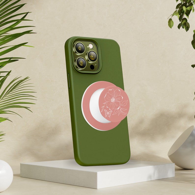Rose Butterfly Collapsable Grip and Stand in White on green phone.