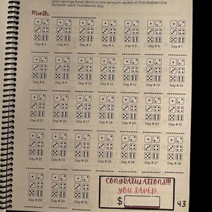 May include: A printable monthly savings challenge with a dice theme. Roll the dice each day and add the amount to your savings fund. Write the amount saved on the dashed line beneath each numbered day.  Congratulations!!! You Saved. $