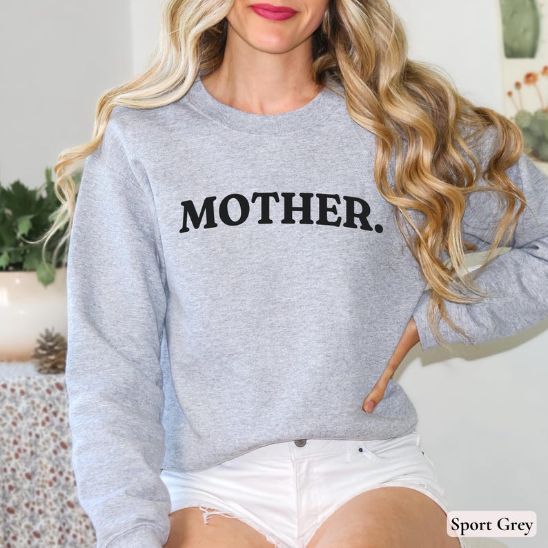 Womans Sport Grey sweatshirt with black text that says Mother in arched text across the upper chest