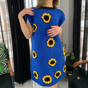 Hand knitted blue dress with Sunflower decorations