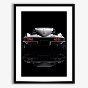 May include: A black classic Corvette sports car viewed from the rear. The car is parked on a black surface and is reflected in a mirror-like surface below. The car has red taillights and a chrome bumper.