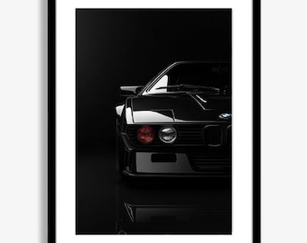 May include: Framed print featuring a black sports car, showcasing the front quarter view. The car has a sleek design with visible headlights, a front grille, and the BMW logo. The image is set against a dark background, with a reflection of the car visible below.