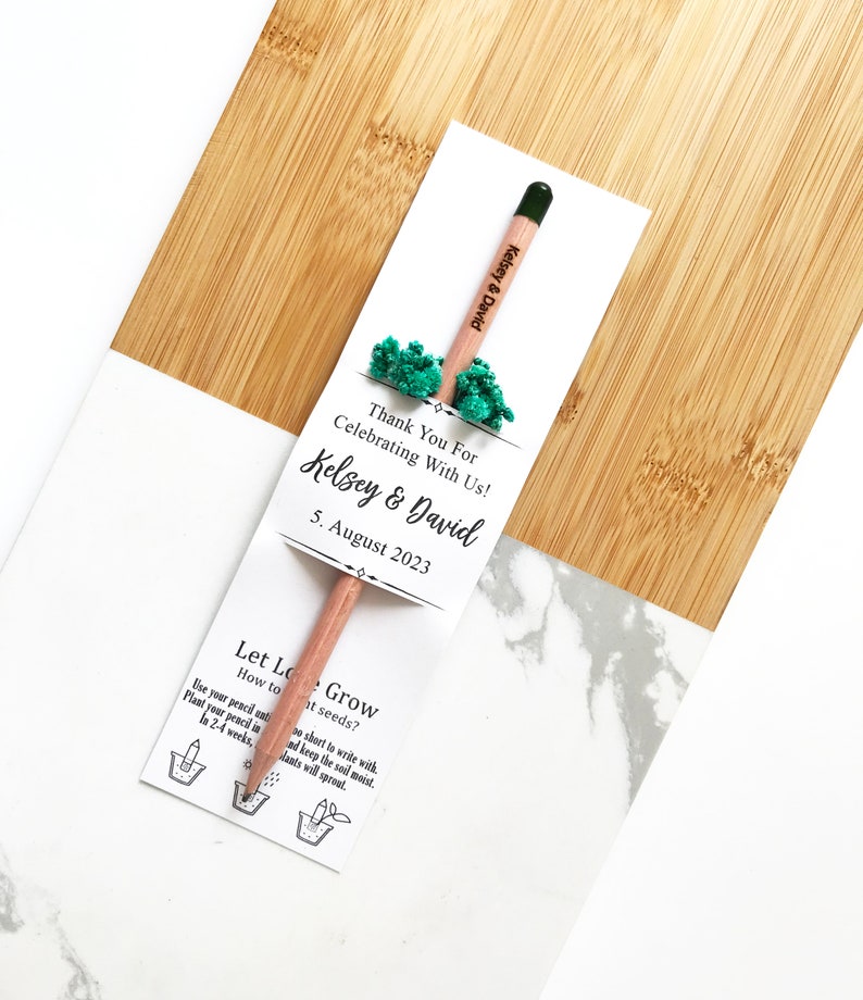 There are colorful flowers and a pencil with seeds on the card.