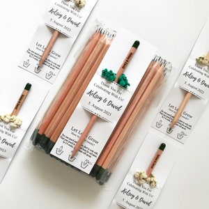 There are colorful flowers and a pencil with seeds on the card.