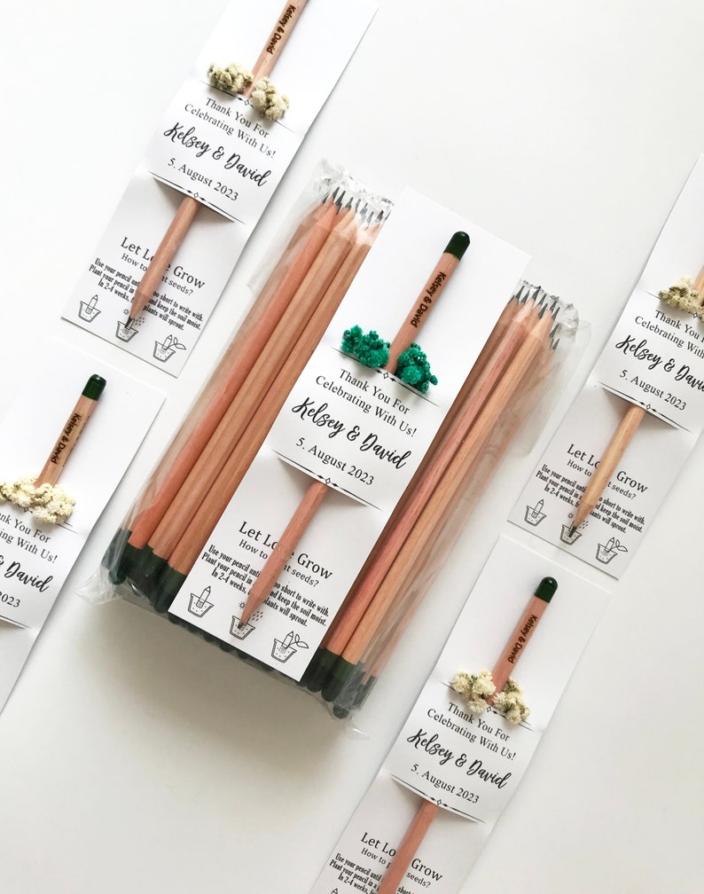 There are colorful flowers and a pencil with seeds on the card.