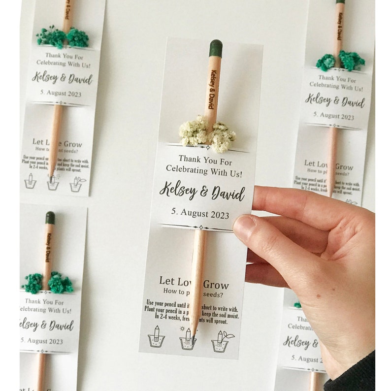 There are colorful flowers and a pencil with seeds on the card.